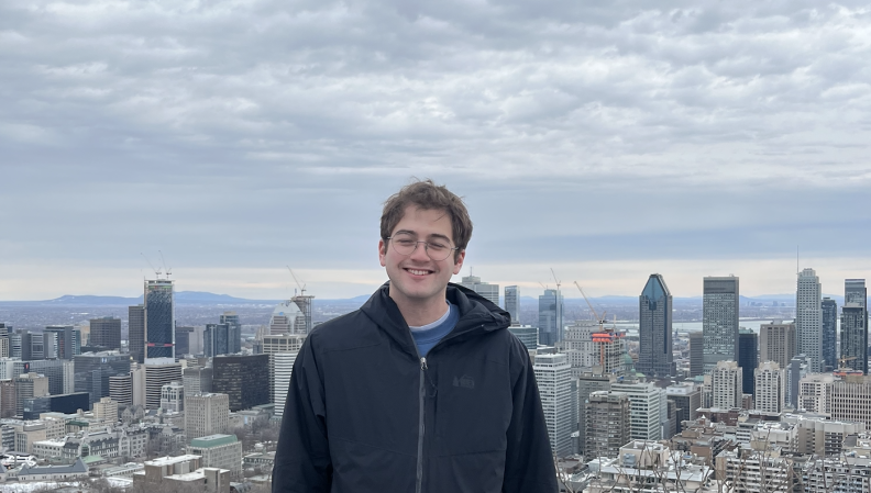 Jacob Feuerstein in front of a city skyline