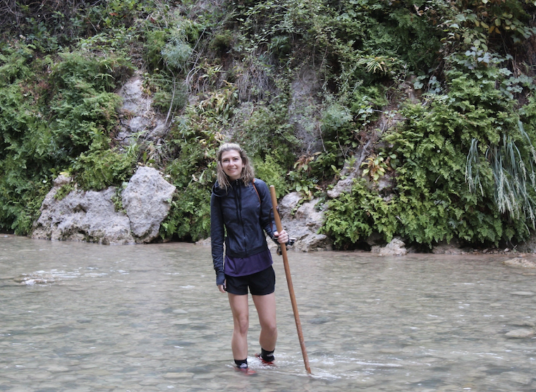Cornell EAS doctoral student Sara Miller crosses a stream in Zion National Park